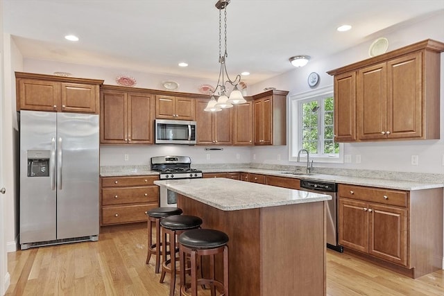 6 Beacon Ct, Acton, MA 01720 - kitchen featuring stainless steel appliances, a sink, brown cabinets, and recessed lighting