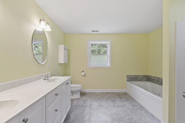 6 Beacon Ct, Acton, MA 01720 - full bathroom featuring double vanity, a tub with jets, toilet, and baseboards