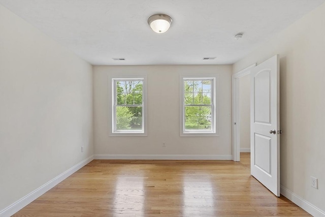 6 Beacon Ct, Acton, MA 01720 - empty room featuring light wood finished floors, baseboards, and a smoke detector