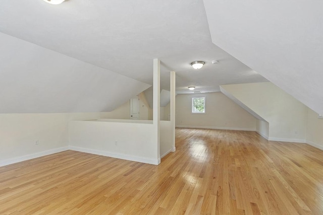 6 Beacon Ct, Acton, MA 01720 - bonus room with light wood-style floors, lofted ceiling, and baseboards