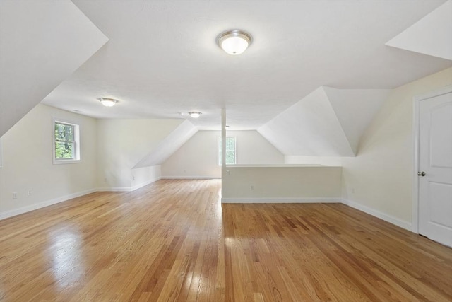 6 Beacon Ct, Acton, MA 01720 - additional living space featuring light wood-type flooring, vaulted ceiling, and baseboards