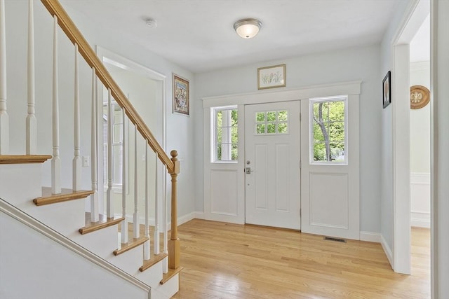 6 Beacon Ct, Acton, MA 01720 - foyer entrance featuring stairs, light wood-style flooring, and baseboards