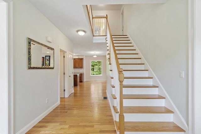 6 Beacon Ct, Acton, MA 01720 - stairs with wood finished floors and baseboards