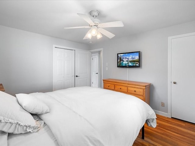 114 Hobart St, Braintree, MA 02184 - bedroom with baseboards, a closet, a ceiling fan, and wood finished floors