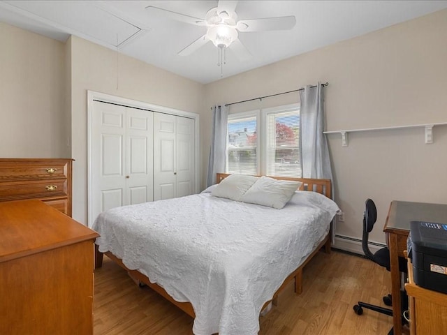 114 Hobart St, Braintree, MA 02184 - bedroom with wood finished floors, attic access, a closet, and a baseboard heating unit