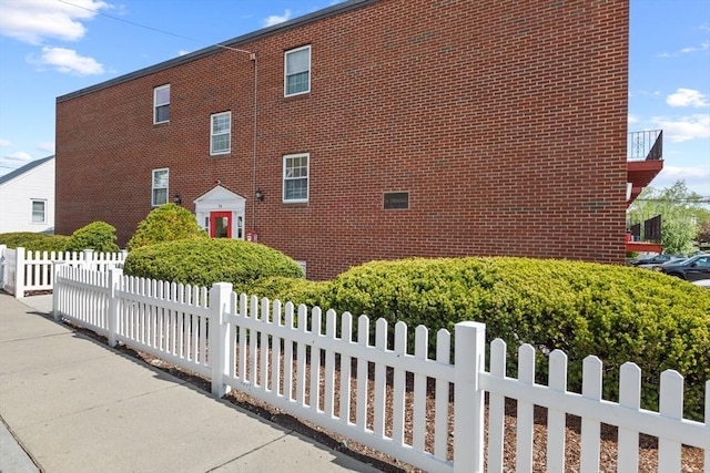 view of property exterior featuring brick siding