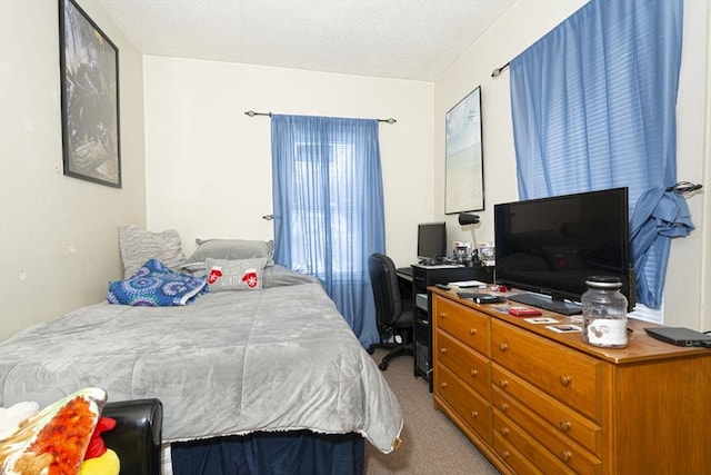 bedroom featuring light carpet