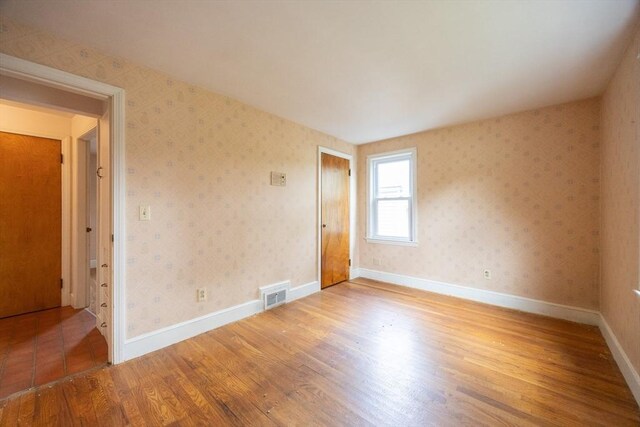 23 Crescent Ave, North Attleboro, MA 02760 - empty room with wood finished floors and baseboards