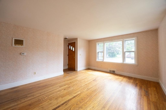 23 Crescent Ave, North Attleboro, MA 02760 - empty room with light wood finished floors and wallpapered walls