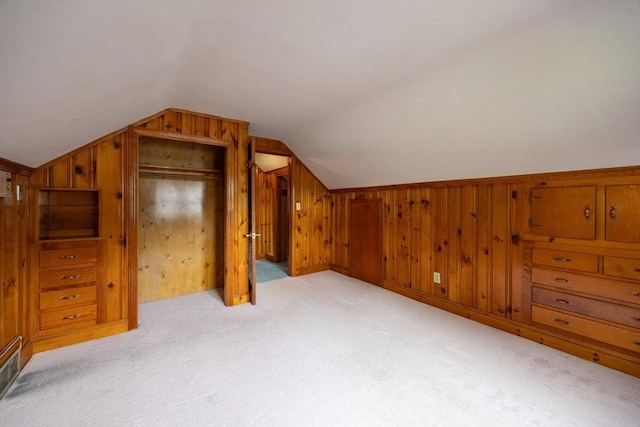 23 Crescent Ave, North Attleboro, MA 02760 - additional living space with light carpet, vaulted ceiling, and wood walls