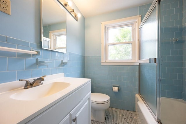 23 Crescent Ave, North Attleboro, MA 02760 - full bathroom featuring vanity, tile walls, tile patterned flooring, bath / shower combo with glass door, and a wainscoted wall