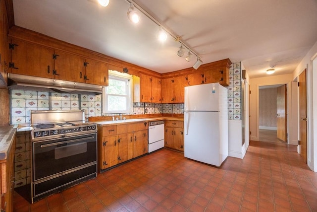 23 Crescent Ave, North Attleboro, MA 02760 - kitchen with white appliances, under cabinet range hood, tasteful backsplash, light countertops, and brown cabinetry