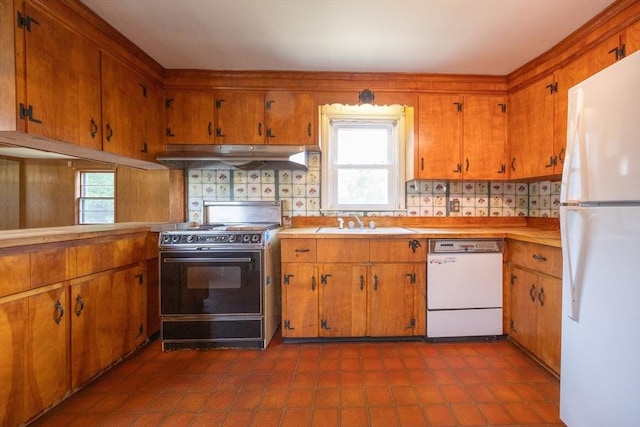23 Crescent Ave, North Attleboro, MA 02760 - kitchen with white appliances, under cabinet range hood, brown cabinets, and light countertops