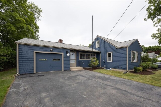 23 Crescent Ave, North Attleboro, MA 02760 - view of front of home featuring a garage, a chimney, and asphalt driveway