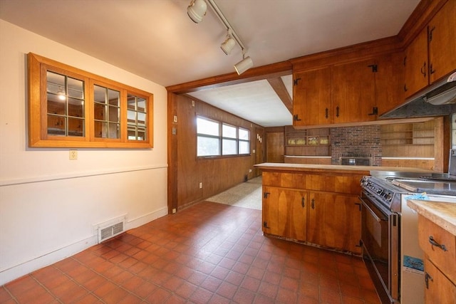 23 Crescent Ave, North Attleboro, MA 02760 - kitchen with range with electric cooktop, brown cabinets, under cabinet range hood, light countertops, and track lighting