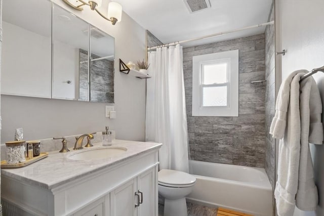 full bathroom with toilet, visible vents, shower / tub combo with curtain, and vanity