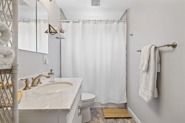 bathroom with visible vents, shower / bathtub combination with curtain, toilet, vanity, and wood finished floors