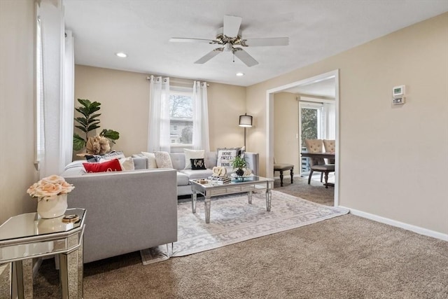 living room with carpet, plenty of natural light, baseboards, and recessed lighting