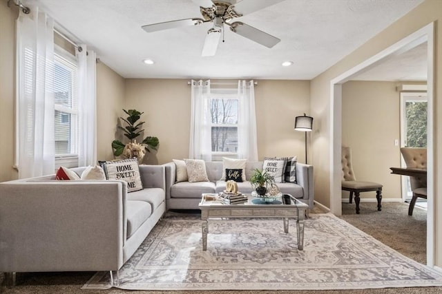 living area with carpet floors, ceiling fan, baseboards, and recessed lighting