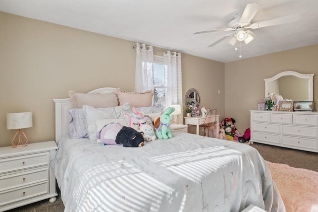 bedroom featuring dark colored carpet and a ceiling fan