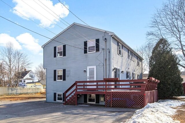 back of house with a wooden deck