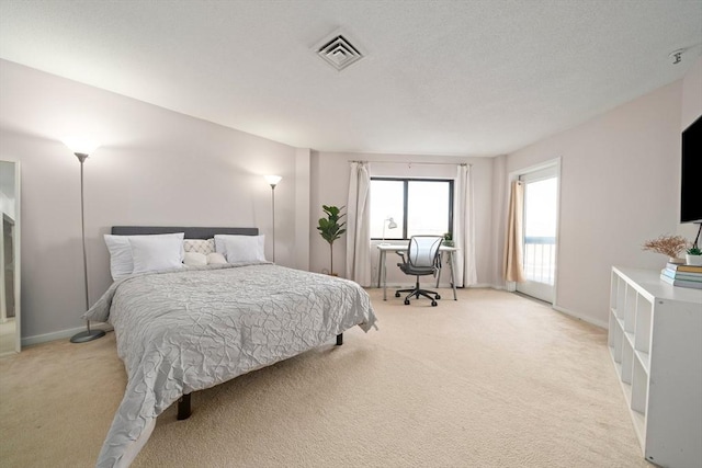 bedroom with light carpet, baseboards, and visible vents