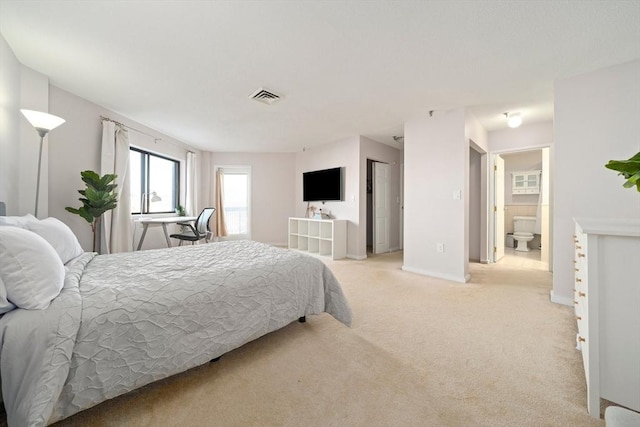 bedroom featuring baseboards, visible vents, and light colored carpet