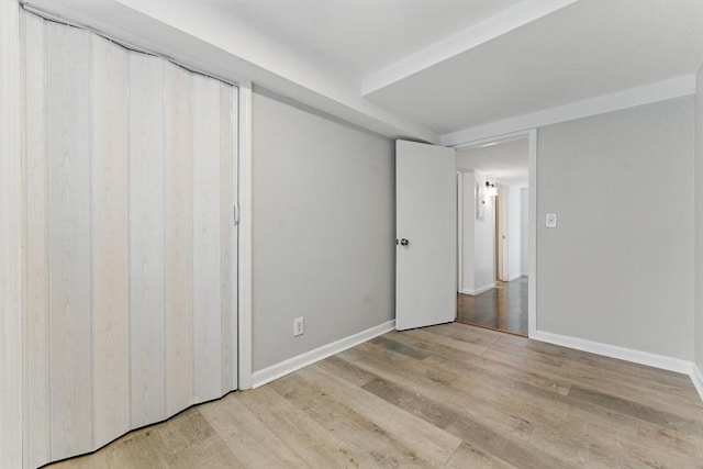 57 Brighton Ave Unit A, Boston, MA 02134 - unfurnished bedroom with wood finished floors and baseboards