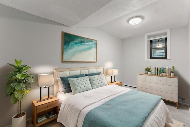 57 Brighton Ave Unit A, Boston, MA 02134 - bedroom featuring lofted ceiling, a baseboard heating unit, baseboards, and light wood finished floors