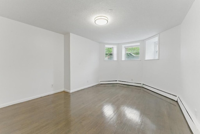 57 Brighton Ave Unit A, Boston, MA 02134 - empty room with wood finished floors, baseboards, and a textured ceiling