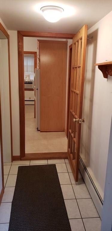 hallway featuring light tile patterned flooring