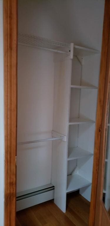 closet featuring a baseboard heating unit