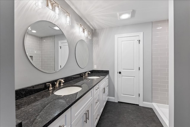 bathroom featuring double vanity and tile patterned flooring