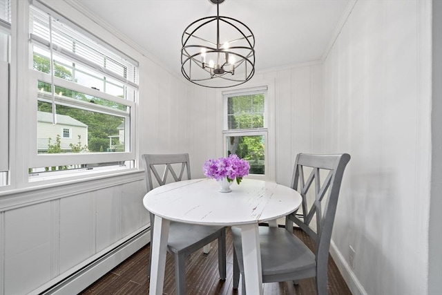 323 N Main St, Cohasset, MA 02025 - dining area featuring baseboard heating, crown molding, a chandelier, dark wood-style floors, and healthy amount of natural light