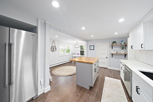 323 N Main St, Cohasset, MA 02025 - kitchen featuring stainless steel appliances, butcher block countertops, open shelves, a baseboard radiator, and dark wood-type flooring