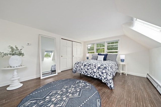 323 N Main St, Cohasset, MA 02025 - bedroom with a baseboard radiator, wood finished floors, a closet, lofted ceiling, and baseboards
