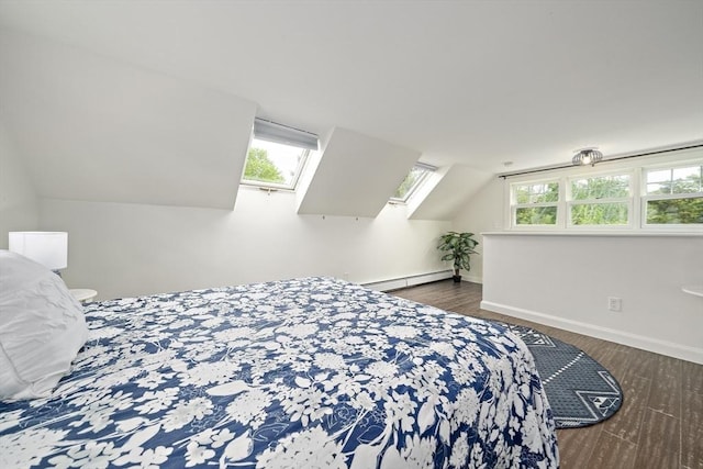 323 N Main St, Cohasset, MA 02025 - bedroom featuring wood finished floors, lofted ceiling, a baseboard heating unit, baseboards, and a skylight