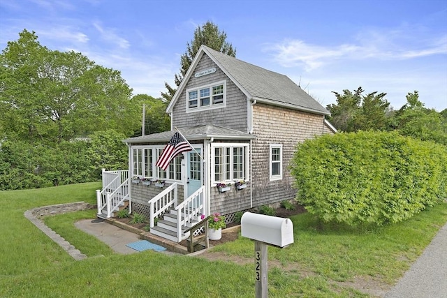 323 N Main St, Cohasset, MA 02025 - view of front facade featuring stairs, a front lawn, a deck, and a shingled roof