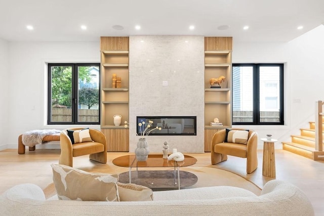 1597 Centre St Unit 2, Newton, MA 02461 - living room with recessed lighting, wood finished floors, stairs, a fireplace, and built in features