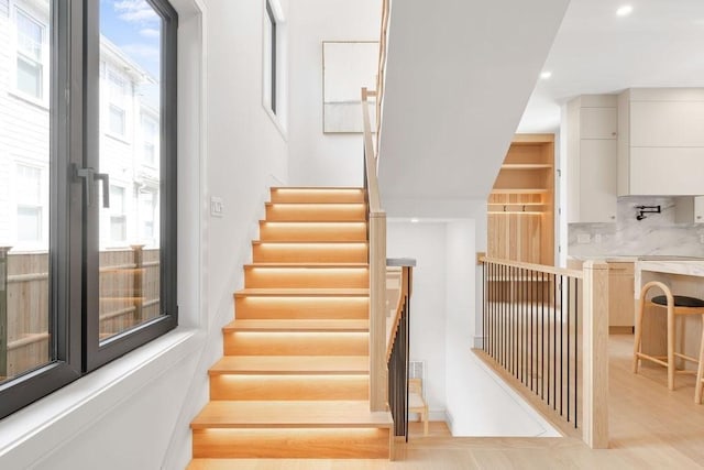 1597 Centre St Unit 2, Newton, MA 02461 - stairway featuring recessed lighting and wood finished floors