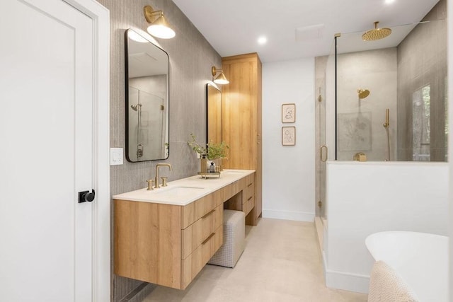 1597 Centre St Unit 2, Newton, MA 02461 - bathroom featuring a shower stall, double vanity, a freestanding bath, recessed lighting, and baseboards