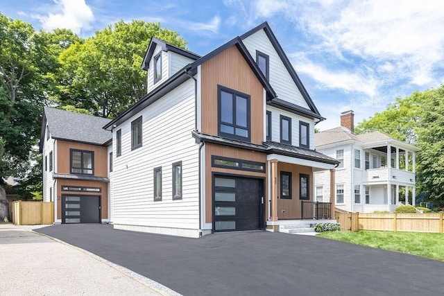 1597 Centre St Unit 2, Newton, MA 02461 - contemporary house with a garage, a standing seam roof, asphalt driveway, and metal roof