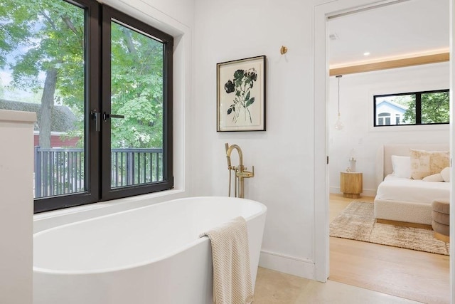 1597 Centre St Unit 2, Newton, MA 02461 - full bath featuring a soaking tub, baseboards, and ensuite bathroom