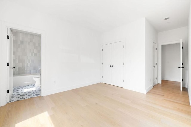 1597 Centre St Unit 2, Newton, MA 02461 - spare room with light wood-type flooring and baseboards