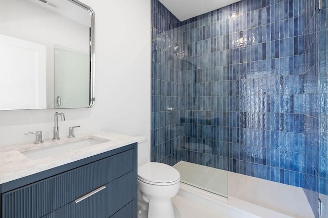 1597 Centre St Unit 2, Newton, MA 02461 - full bath with tiled shower, toilet, and vanity