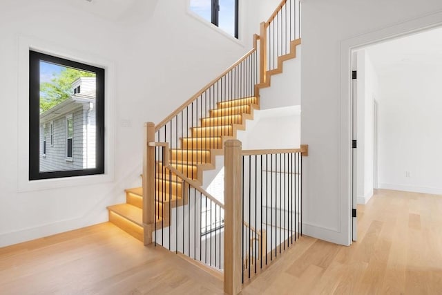 1597 Centre St Unit 2, Newton, MA 02461 - stairs featuring wood finished floors and baseboards
