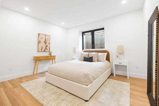 1597 Centre St Unit 2, Newton, MA 02461 - bedroom featuring wood finished floors, baseboards, and recessed lighting
