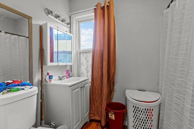 bathroom featuring toilet and vanity