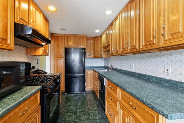 kitchen featuring under cabinet range hood, black appliances, dark countertops, brown cabinetry, and recessed lighting