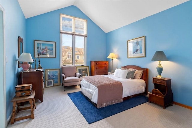 bedroom featuring carpet and lofted ceiling